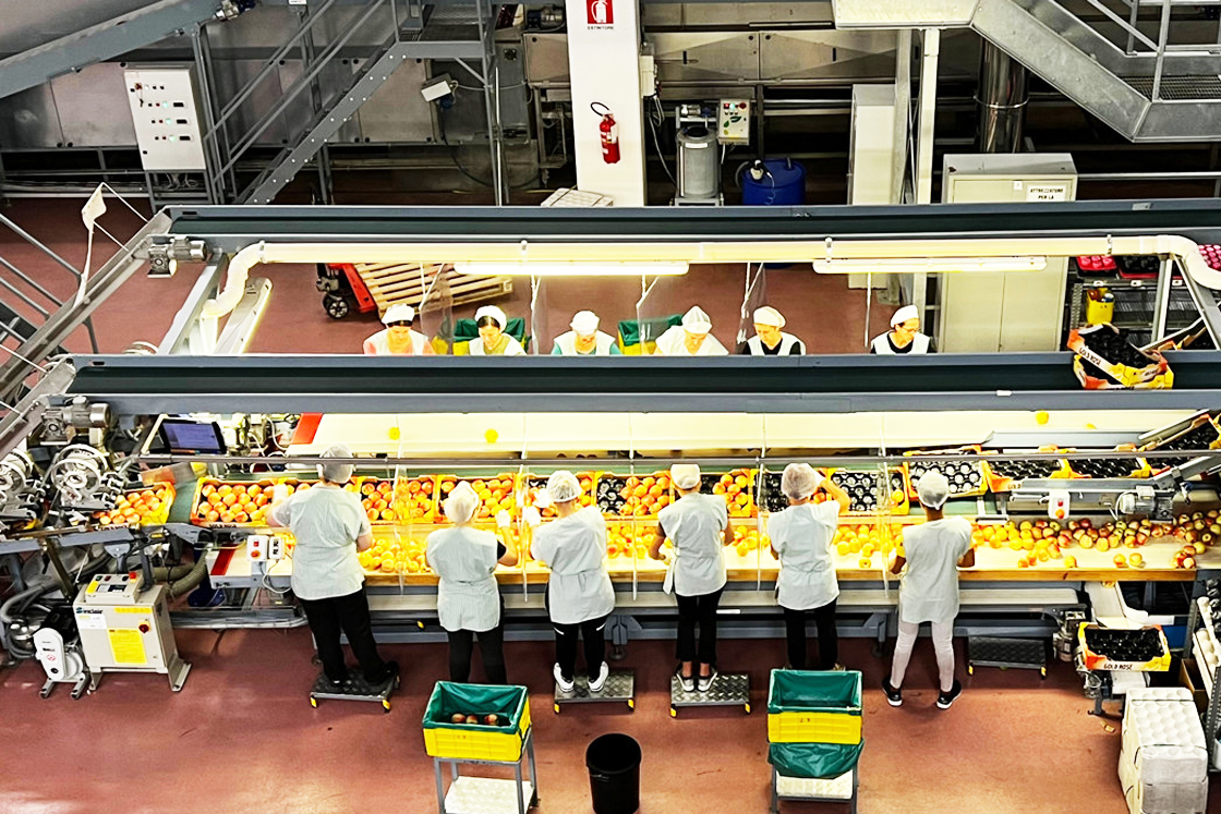 Rivoira factory workers at a conveyor belt