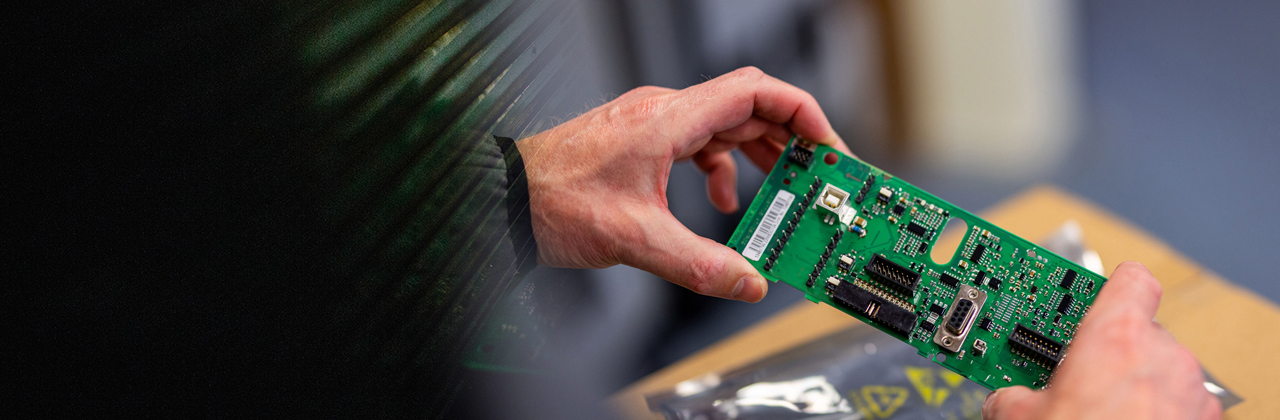 Person gathering spare parts at a Danfoss factory