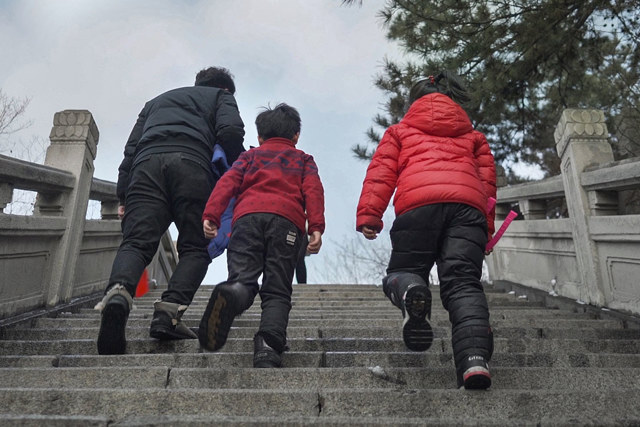 People walking up stairs in Benxi