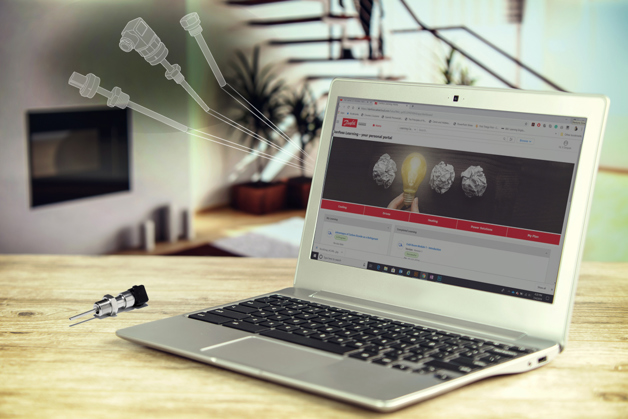 Laptop computer featuring the Danfoss learning page on the screen