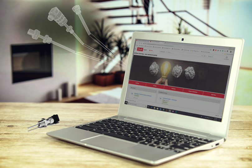 Laptop computer featuring the Danfoss learning page on the screen