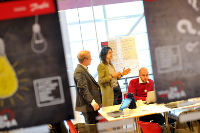 People working, talking behind signs