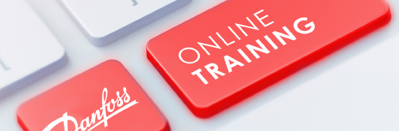 White keyboard with two red keys that say "Danfoss" and "Online learning"