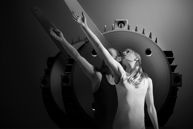 2 synchronized dancers in front of a motor