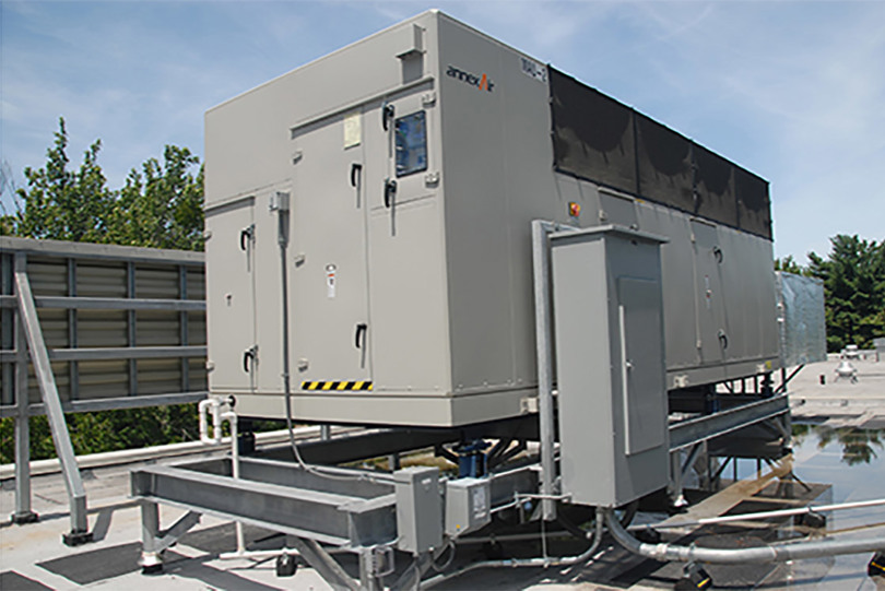 A dark grey rooftop unit from the case study looking at humidity control, energy efficiency in buildings and colleges by Danfoss