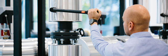 Man working with Danfoss heating system