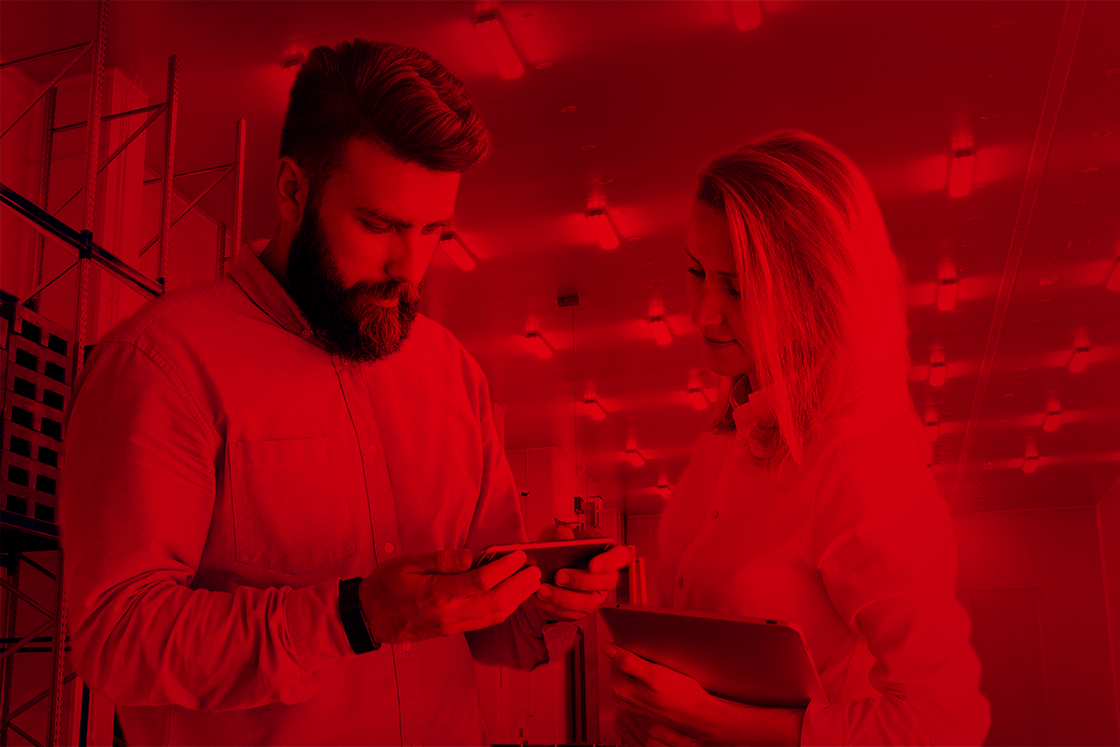 Man and woman looking at smartphone