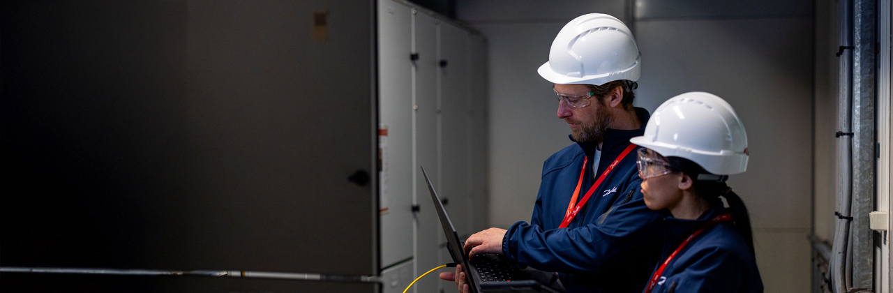 Person gathering spare parts at a Danfoss factory