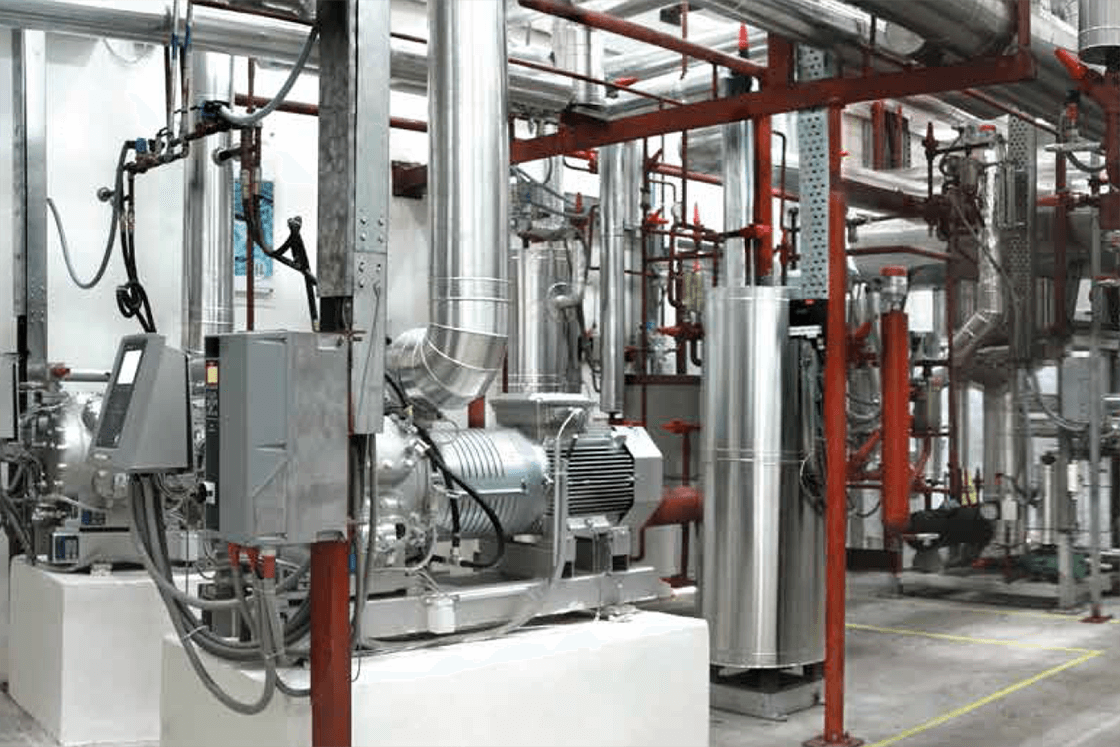 Photo of an industrial room where there are Danfoss products related to industrial refrigeration
