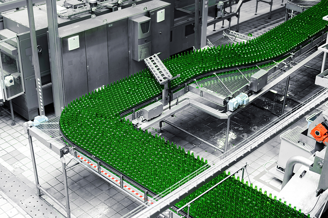 Bottling line full of green bottles