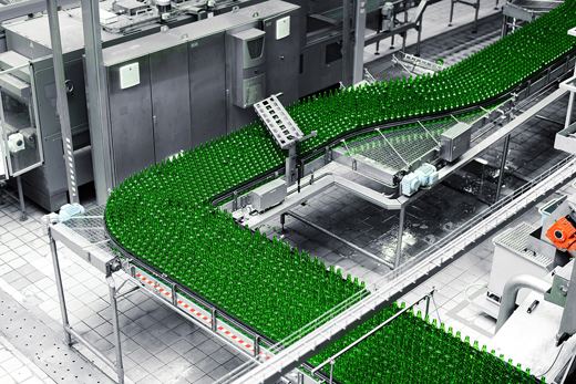 Bottling line full of green bottles