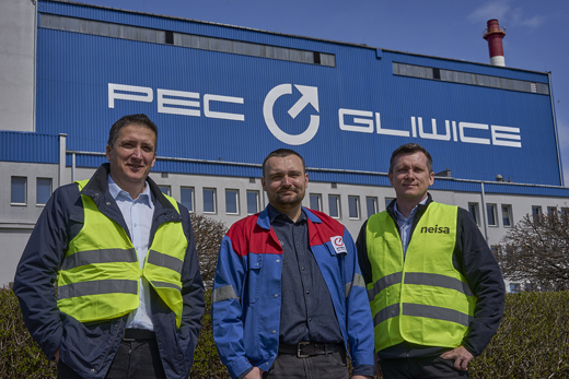 Krzysztof Szalinski and Marcin Drosdowsky of PEC Gliwice and Michal Michulec of Neisa standing in front of the PEC building