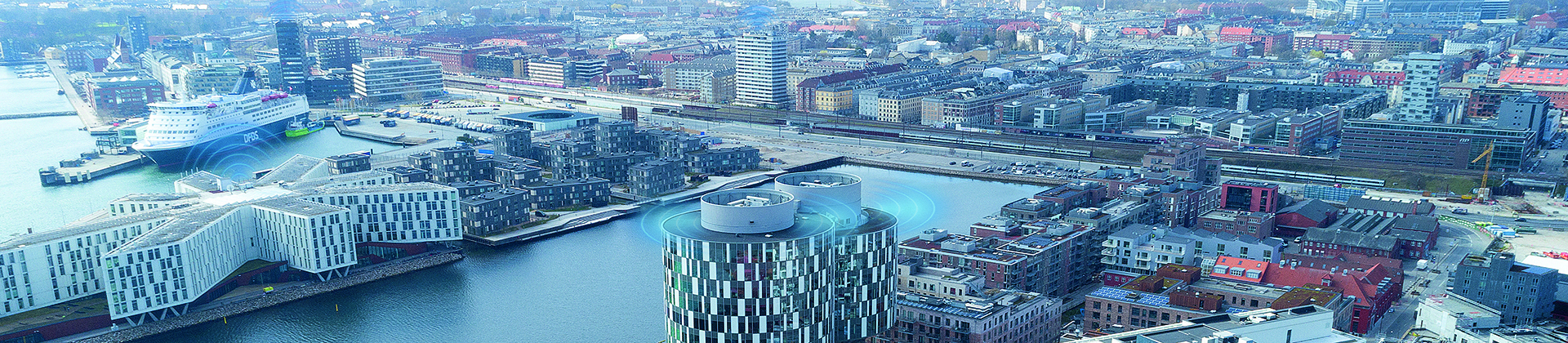 Aerial view of Nordhavn in Copenhagen, with a condition-based monitoring signal showing on top of several buildings