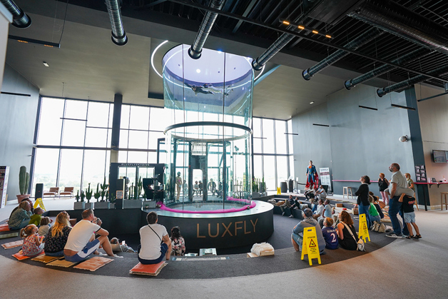 People sitting around the wind tunnel