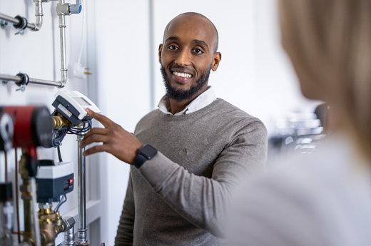 Service man looking at the Danfoss documentation