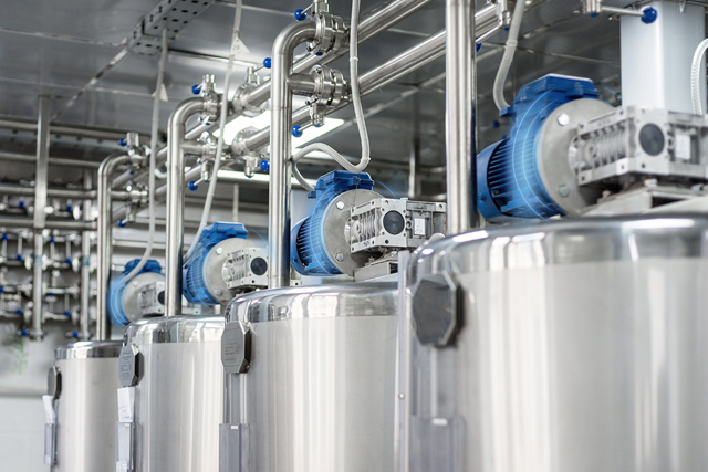 Four electric motors with blue lines around them indicating condition monitoring sensors