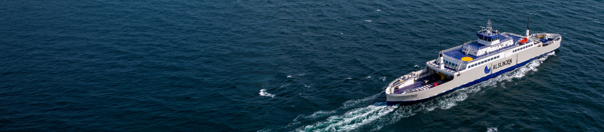 A ferry and cruise ship with "100% electric" and "zero emissions" written above them