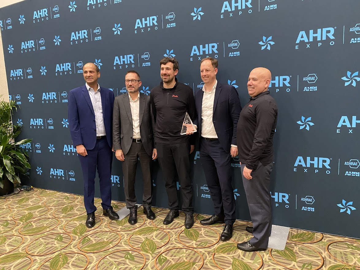 L-R: Vikas Anand, vice president of sales, North America, Danfoss Climate Solutions; Kristian Strand, president, Danfoss Commercial Compressors; Manuel Froeschle, head of product management, BOCK; Ralf Havermann, head of Danfoss BOCK; Howell Feig, product line director, BOCK, North America accept the Innovation Award in the Refrigeration category for the BOCK HGX56 CO2 T compressor.