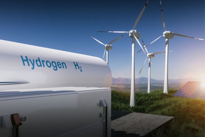 Hydrogen tank with windmills and solar panels in the background