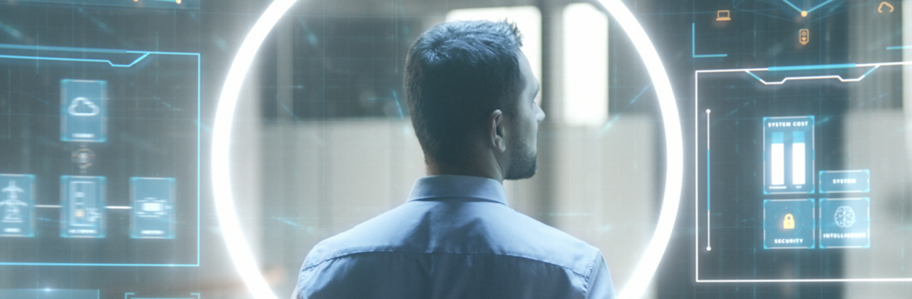 Man standing in front of a virtual wall surrounded by the iC7 halo