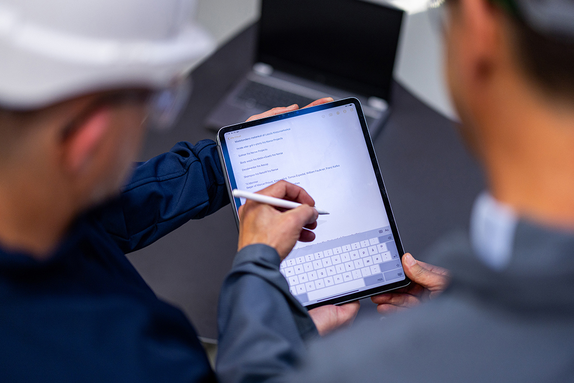 two man configuring settings