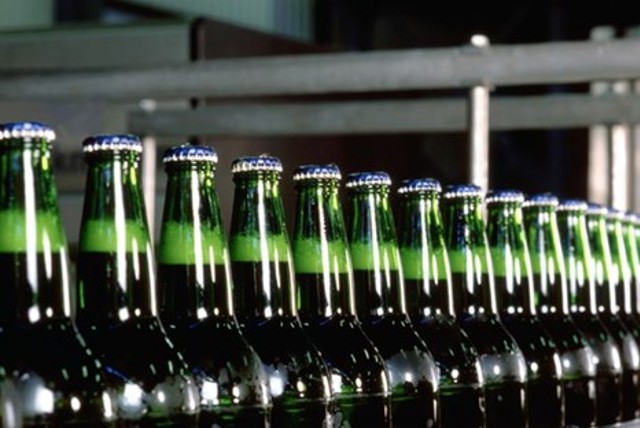 Carlsberg beer bottles on a bottling line