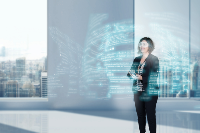 A woman who stands and work on software code