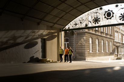 3 men walking at Carlsberg's Okocim Brewery