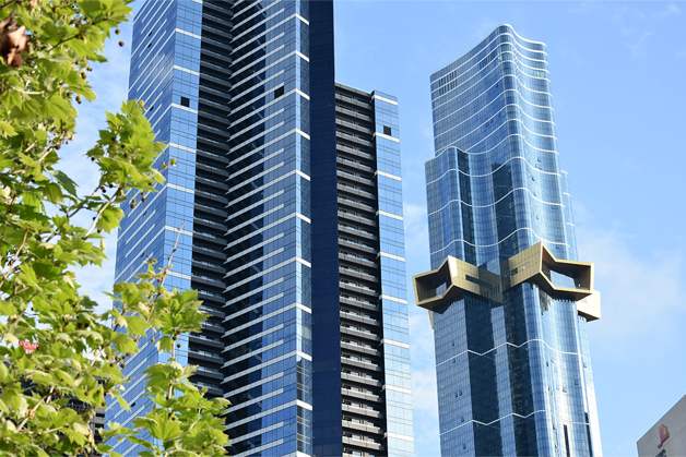 Energy efficient, high rise buildings with trees in the foreground