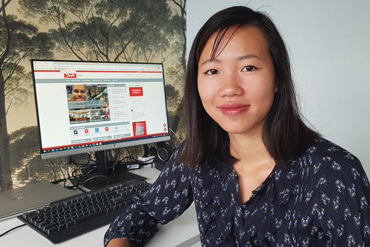 Anna sitting at her working desk