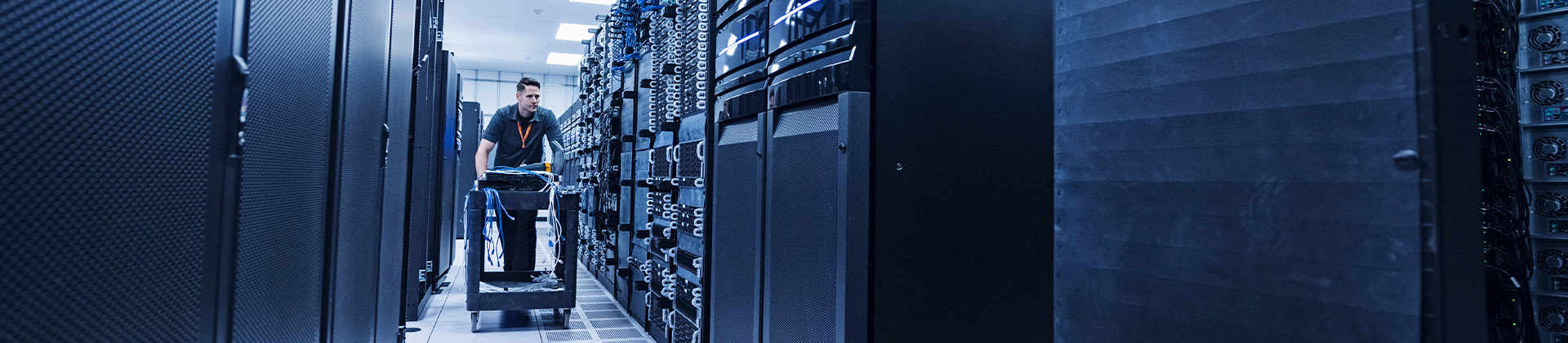 Man walking through a server room